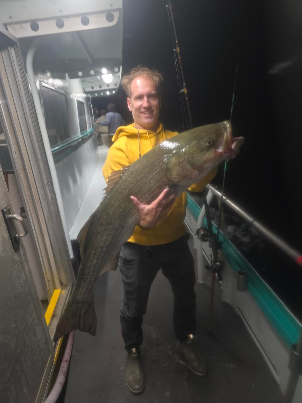 a person holding a fish