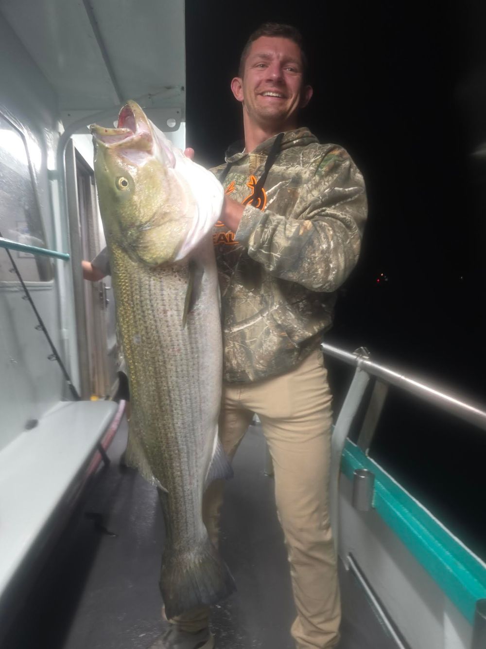 a person holding a fish