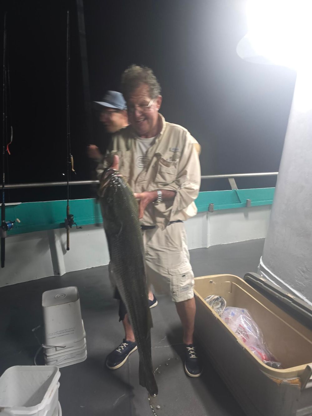 a man holding a fish