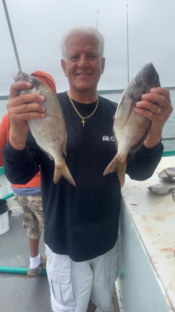 a person holding a fish