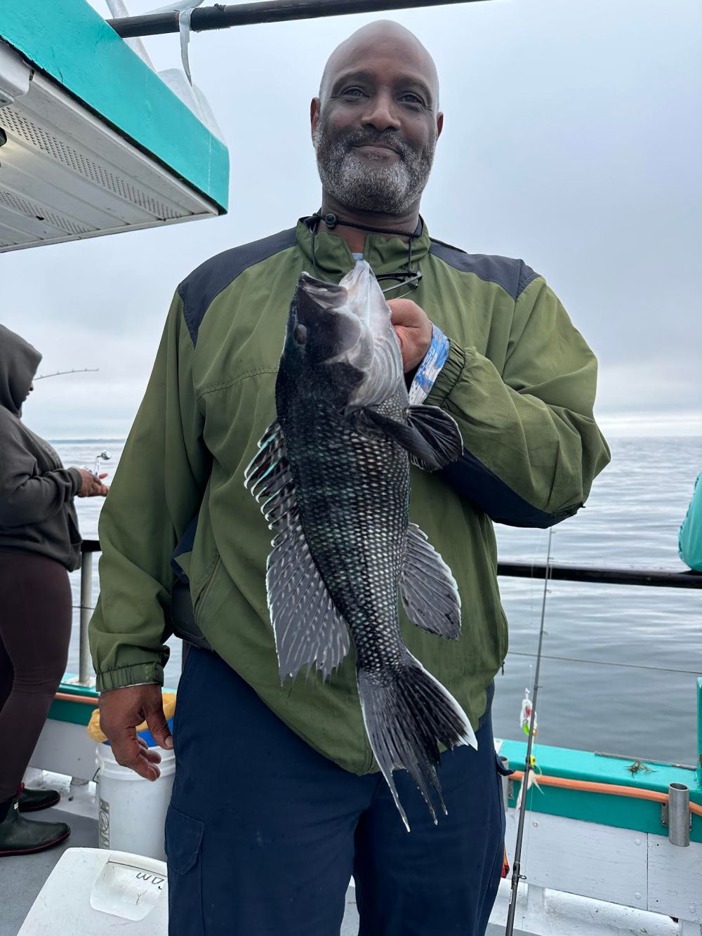 a man holding a fish