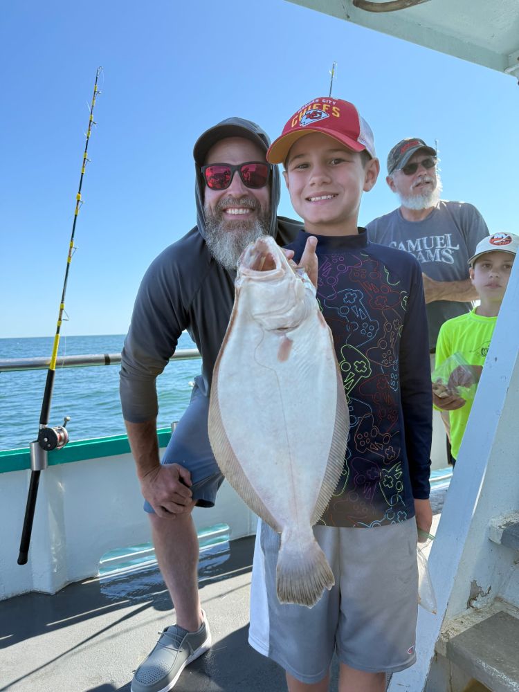 a couple of people that are standing in the water