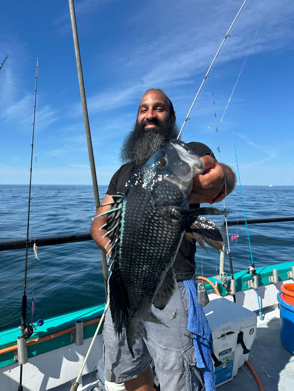 a person standing next to a body of water