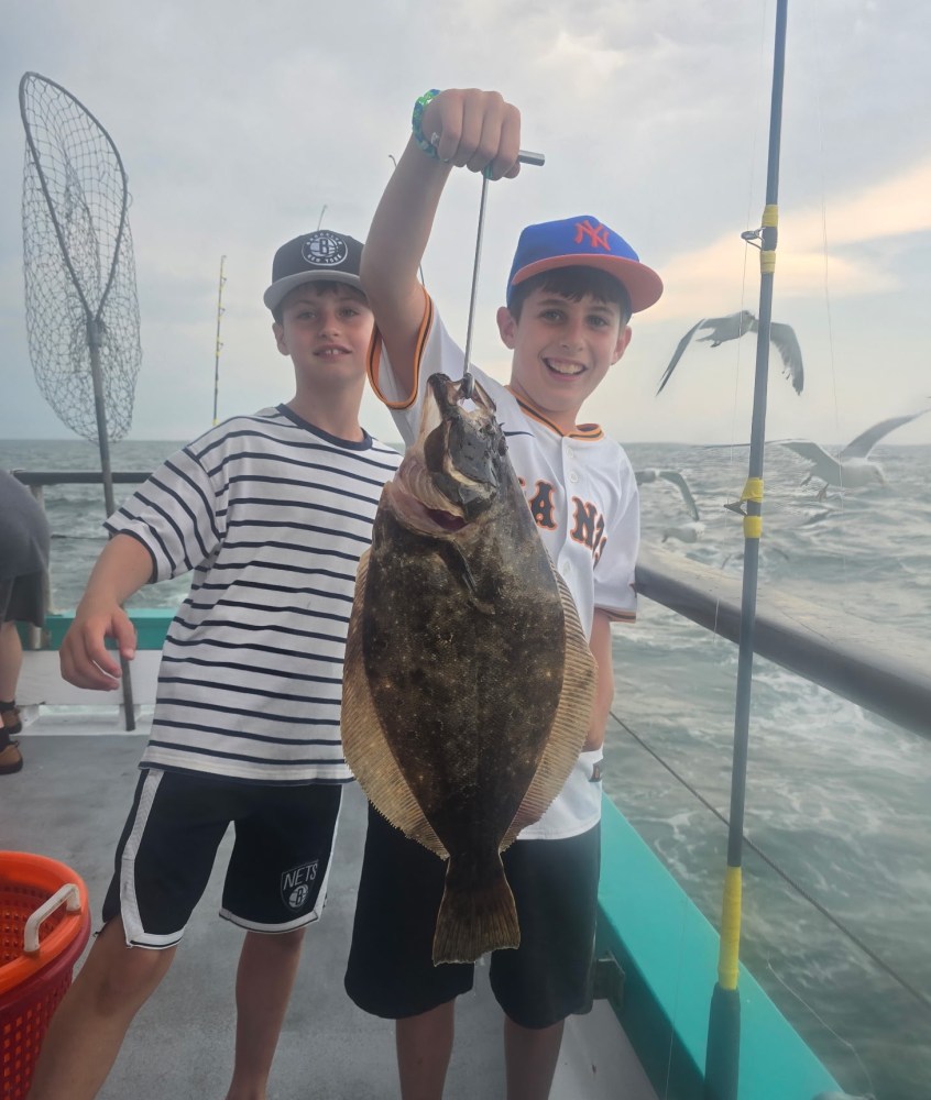 a person holding a fish