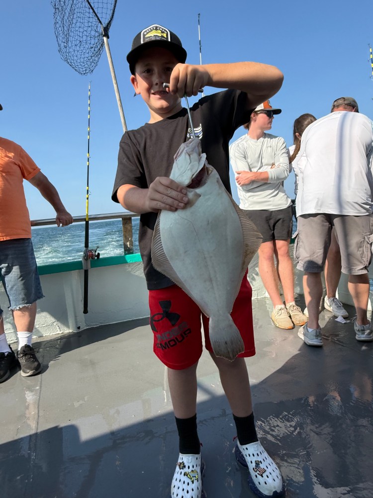 a couple of people that are standing in the water