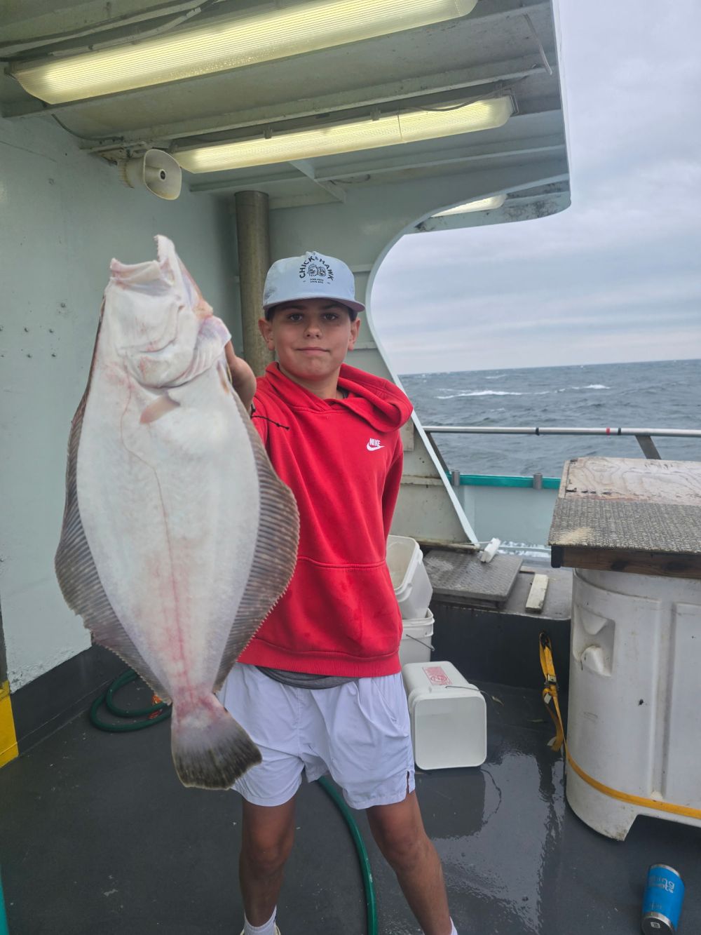 a person holding a fish in the water