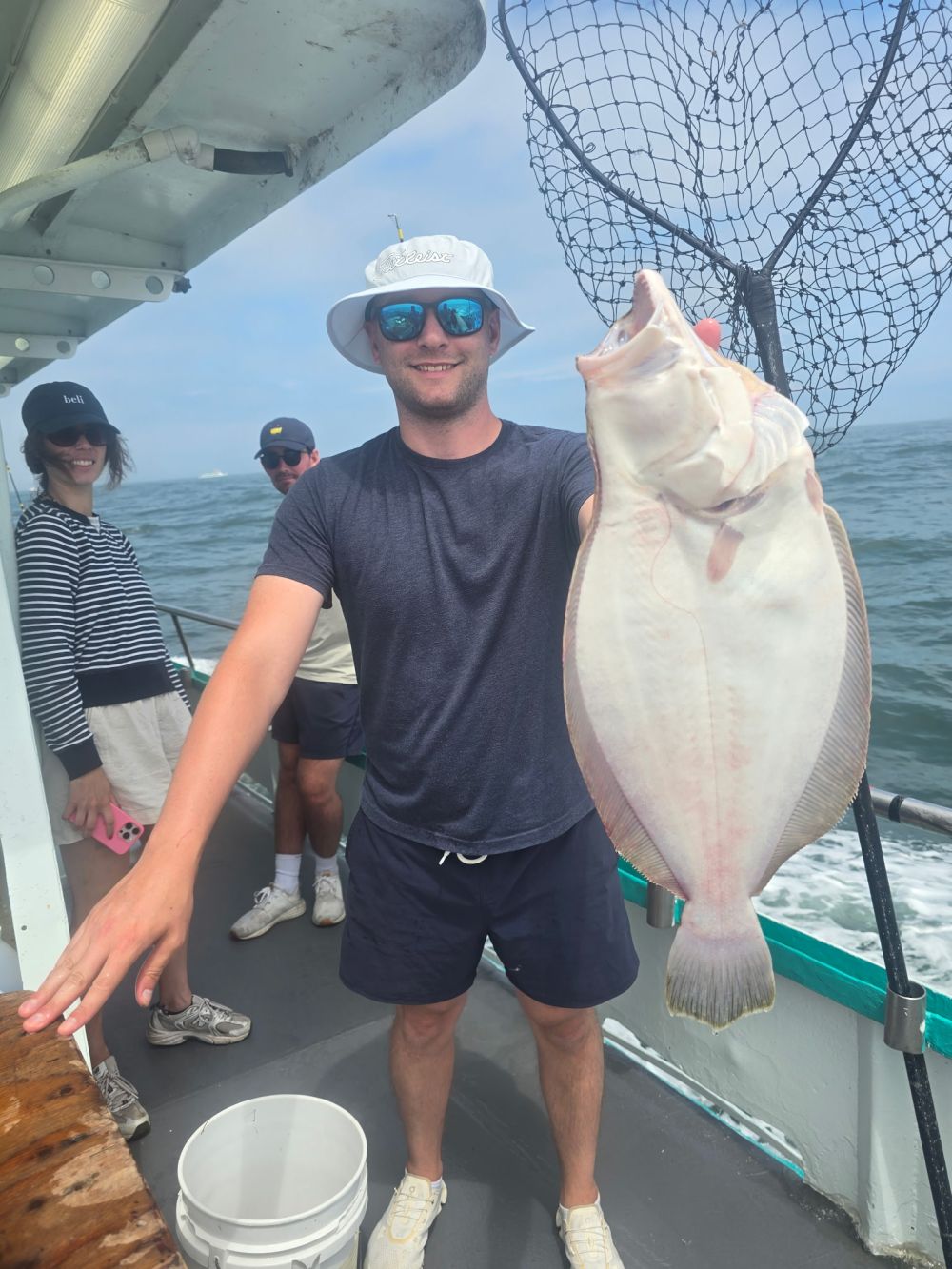 a man holding a fish