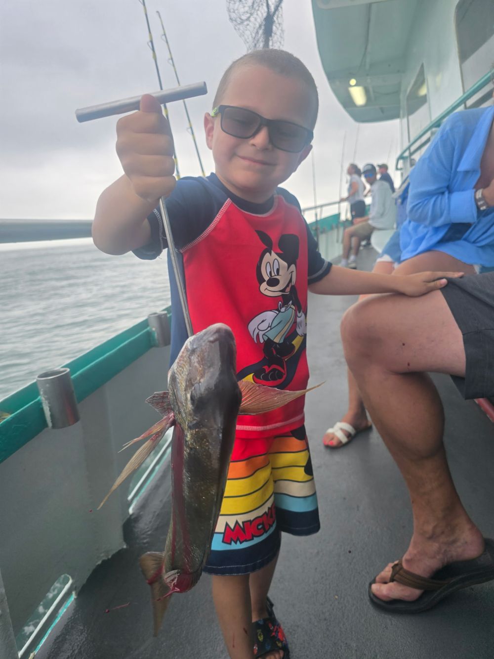 a person holding a child on a boat