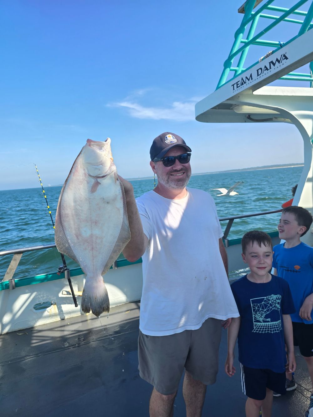 a man holding a fish in the water