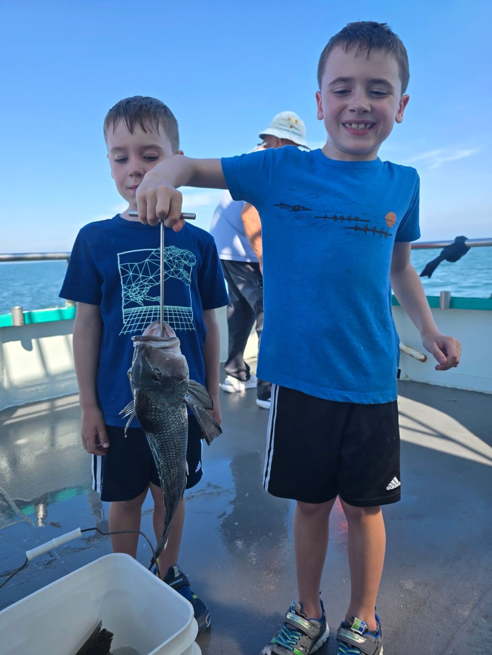 a little boy that is standing in the water