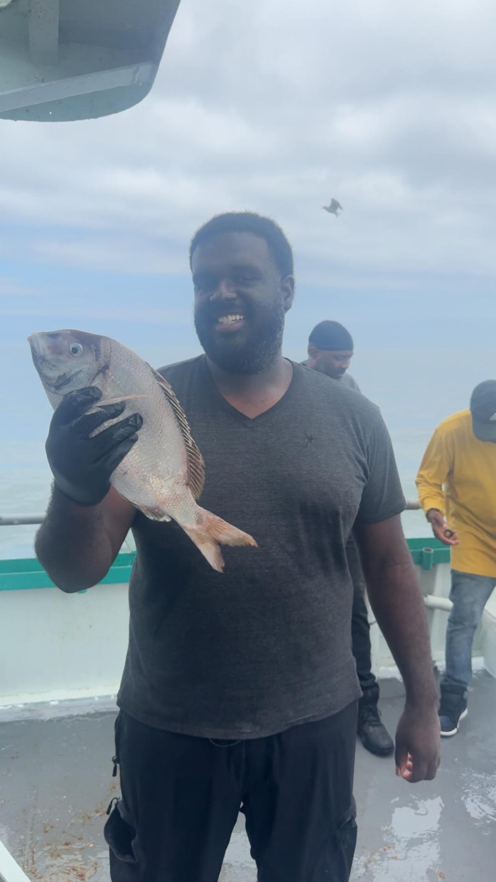 a man holding a fish