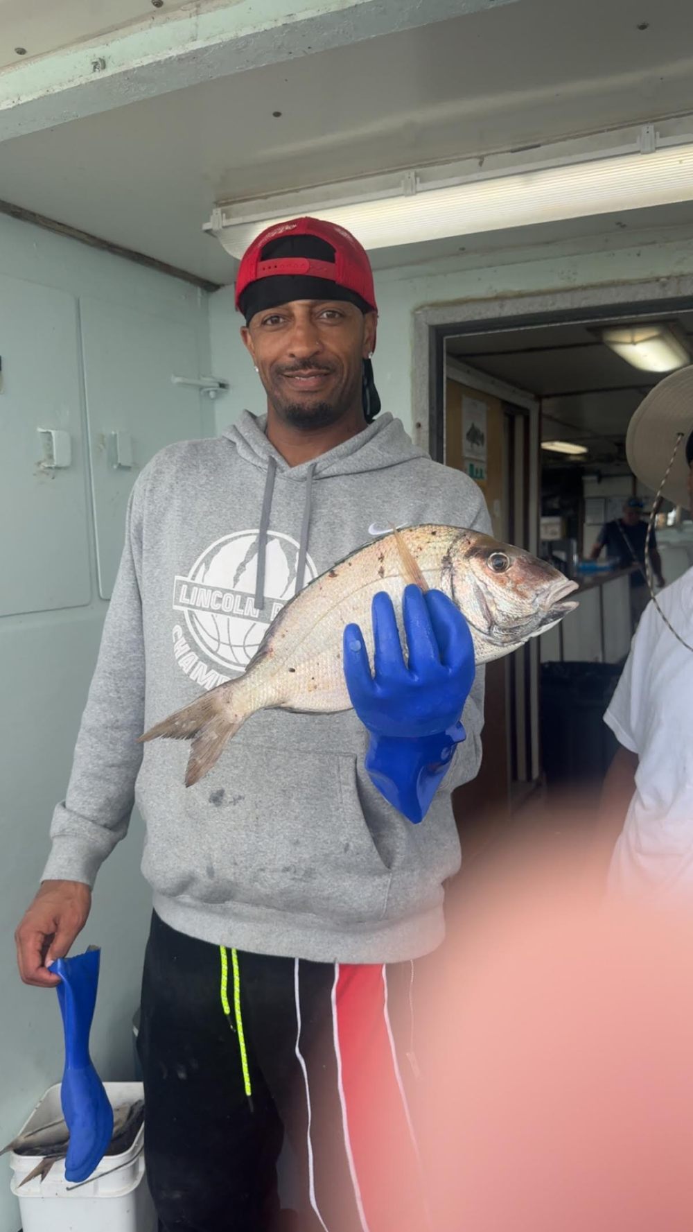 a man holding a fish