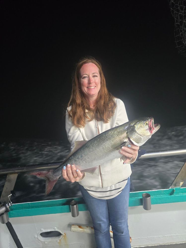 a person holding a fish