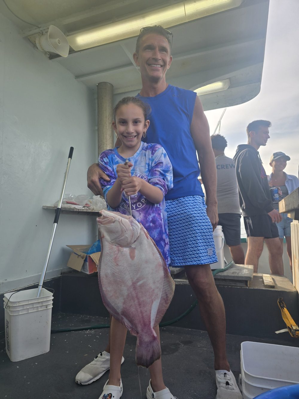 a person standing next to a suitcase