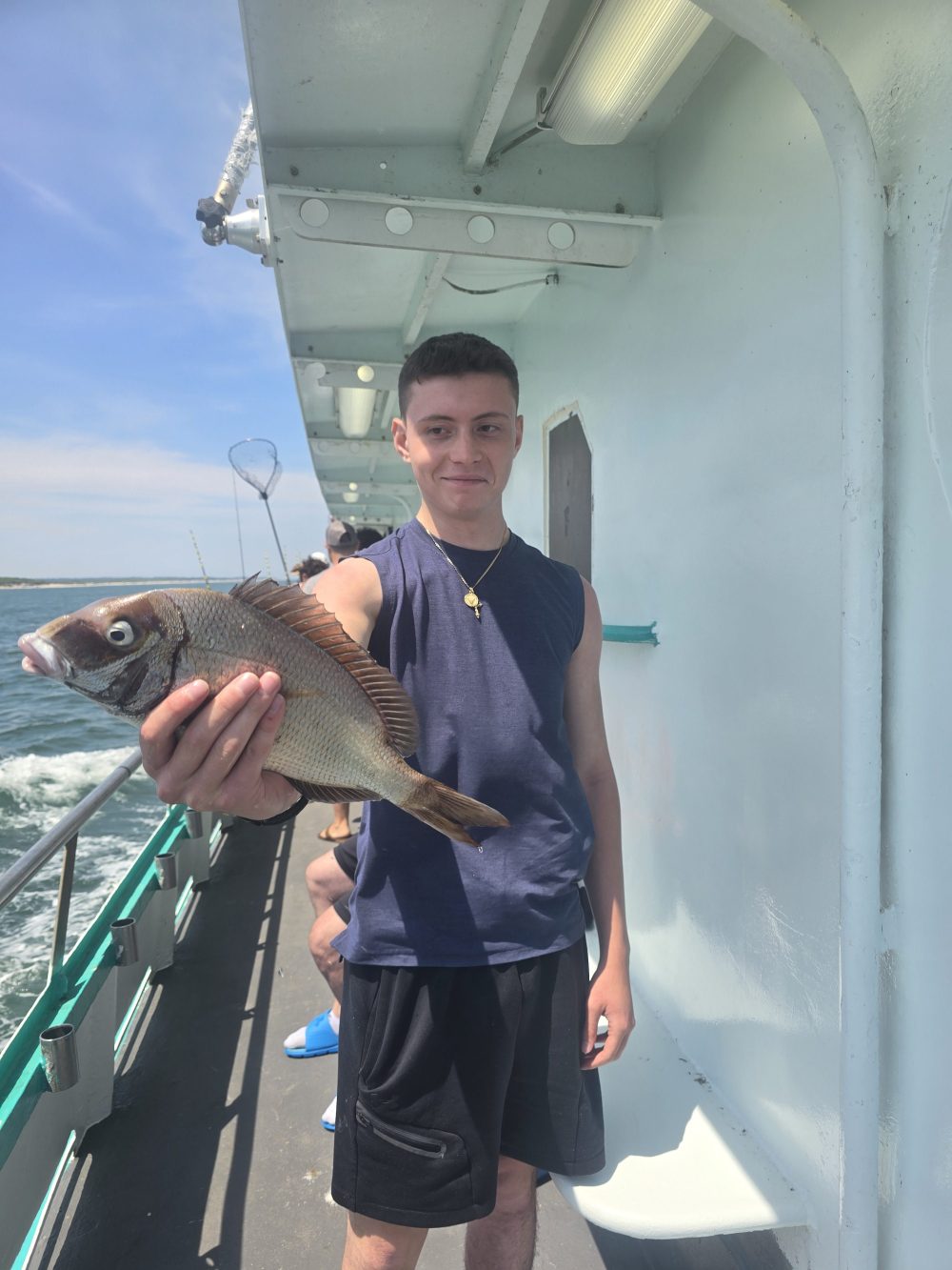 a man holding a fish