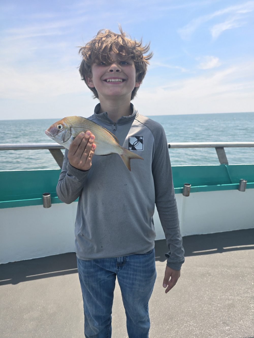 a person standing in front of a body of water