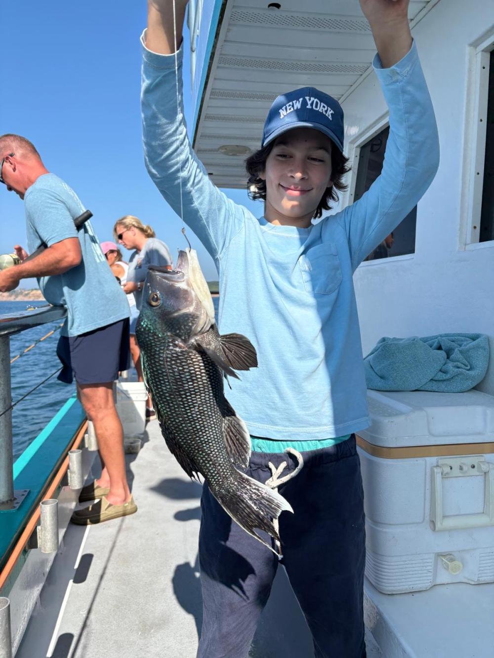 a person holding a fish