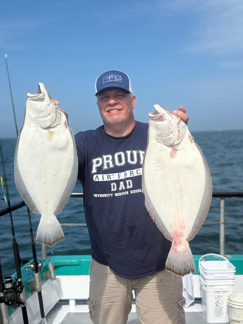 a man holding a fish