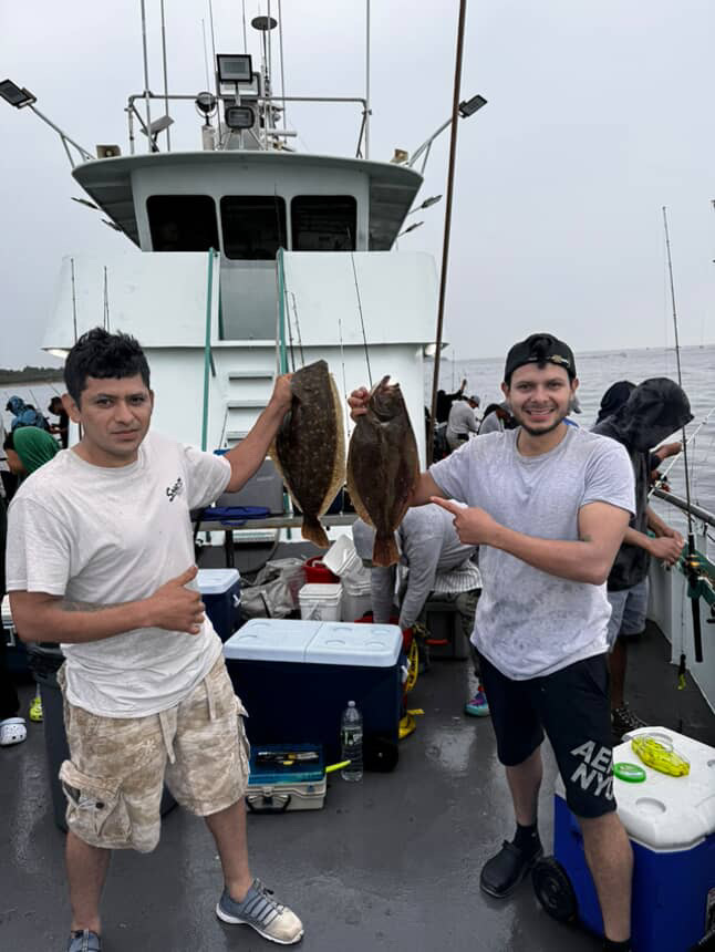 a group of people standing on a boat