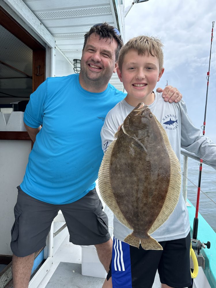 a person holding a fish