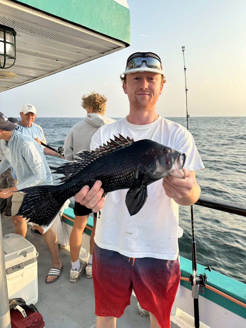 a man holding a fish
