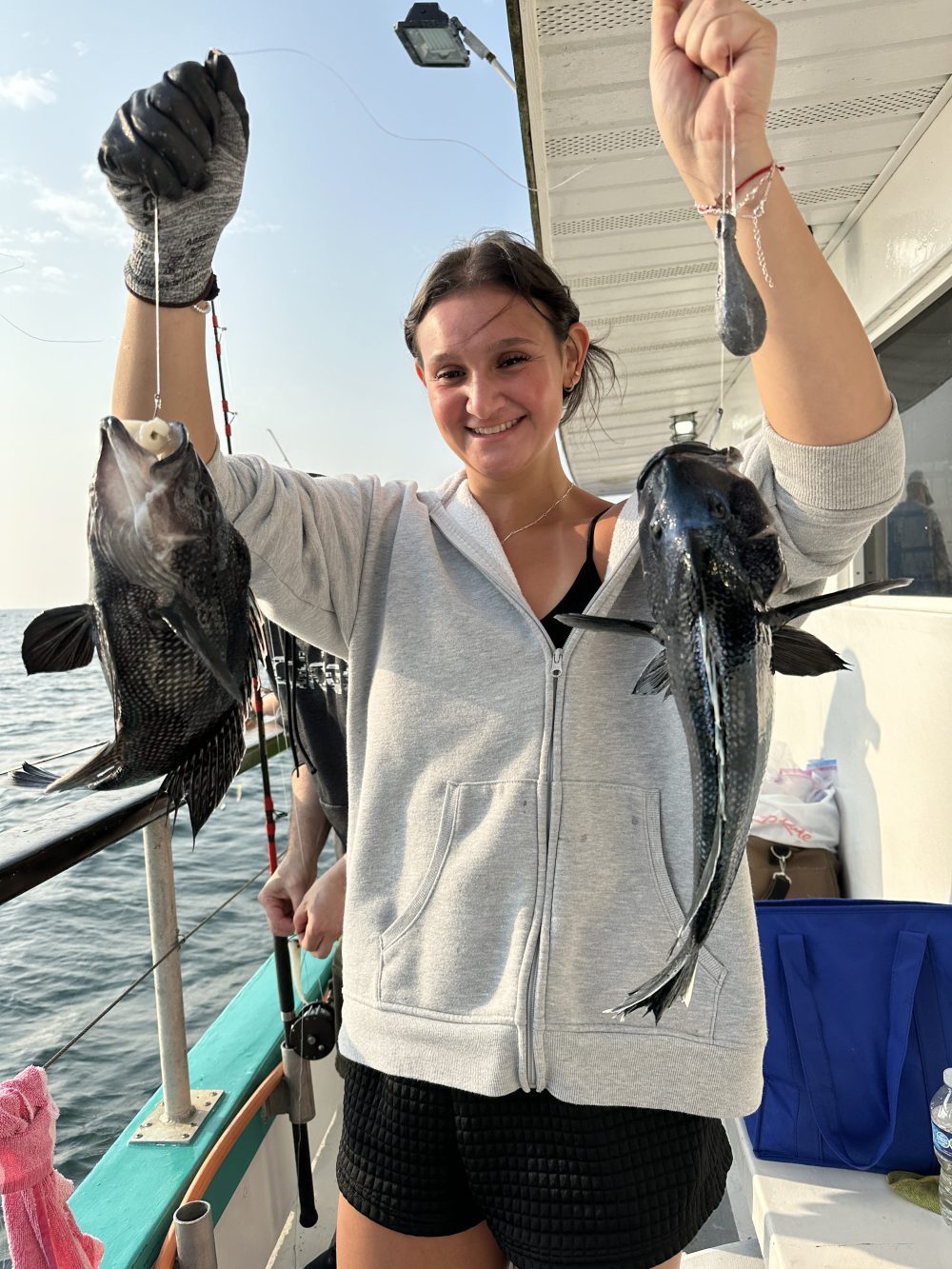 a person holding a fish